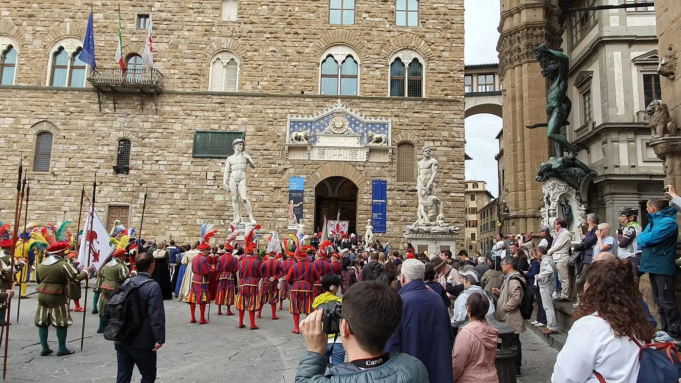 Costumed members of the historic procession of the Florentine Republic in Piazza della Signoria, in front of Palazzo Vecchio