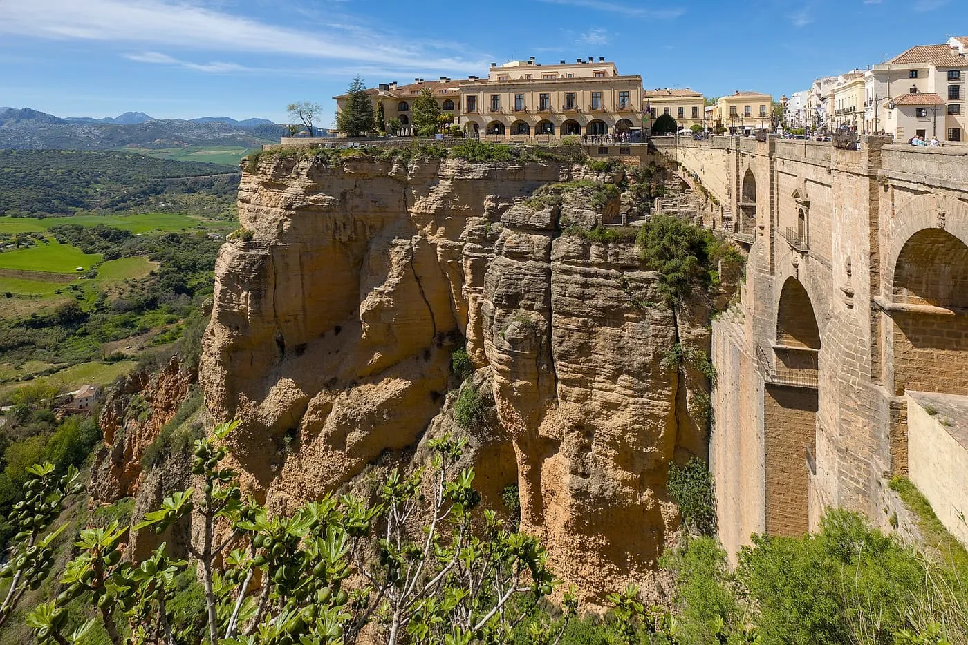 The Puente Nuevo spanning the gorge at Ronda, with the sandstone cliff, the Parador and the valley beyond
