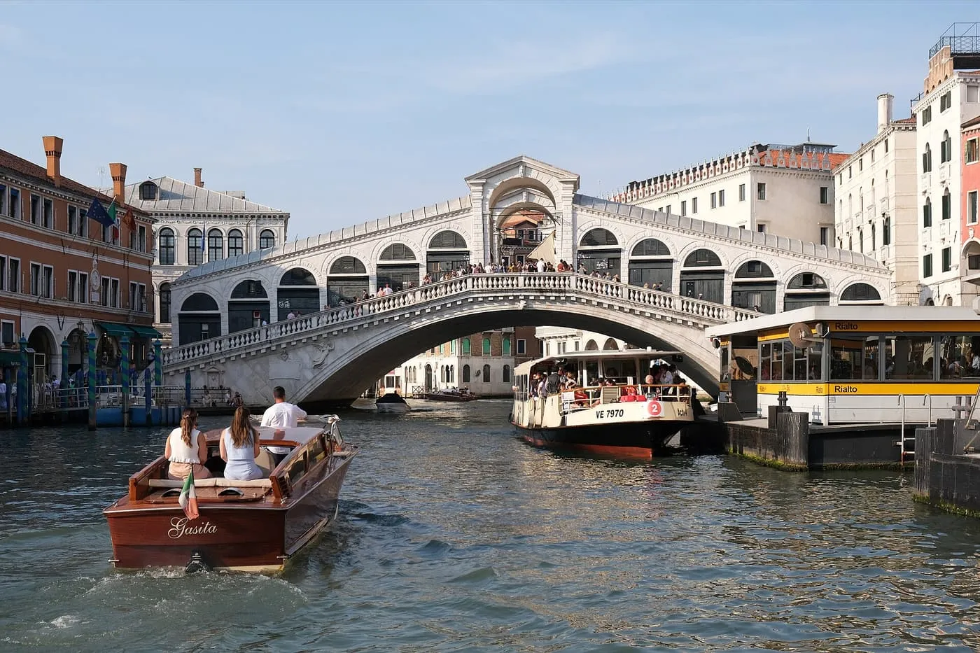 The Rialto Bridge from the Grand Canal, with a vaporetto stop and boats in front