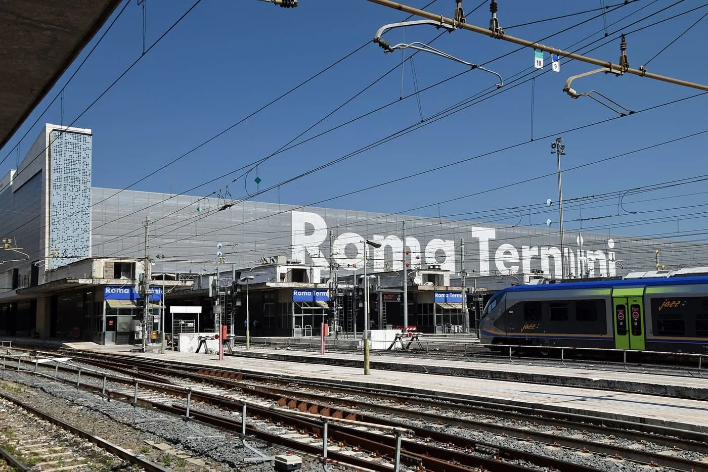 The Roma Termini name in large letters above the tracks and platforms at the station