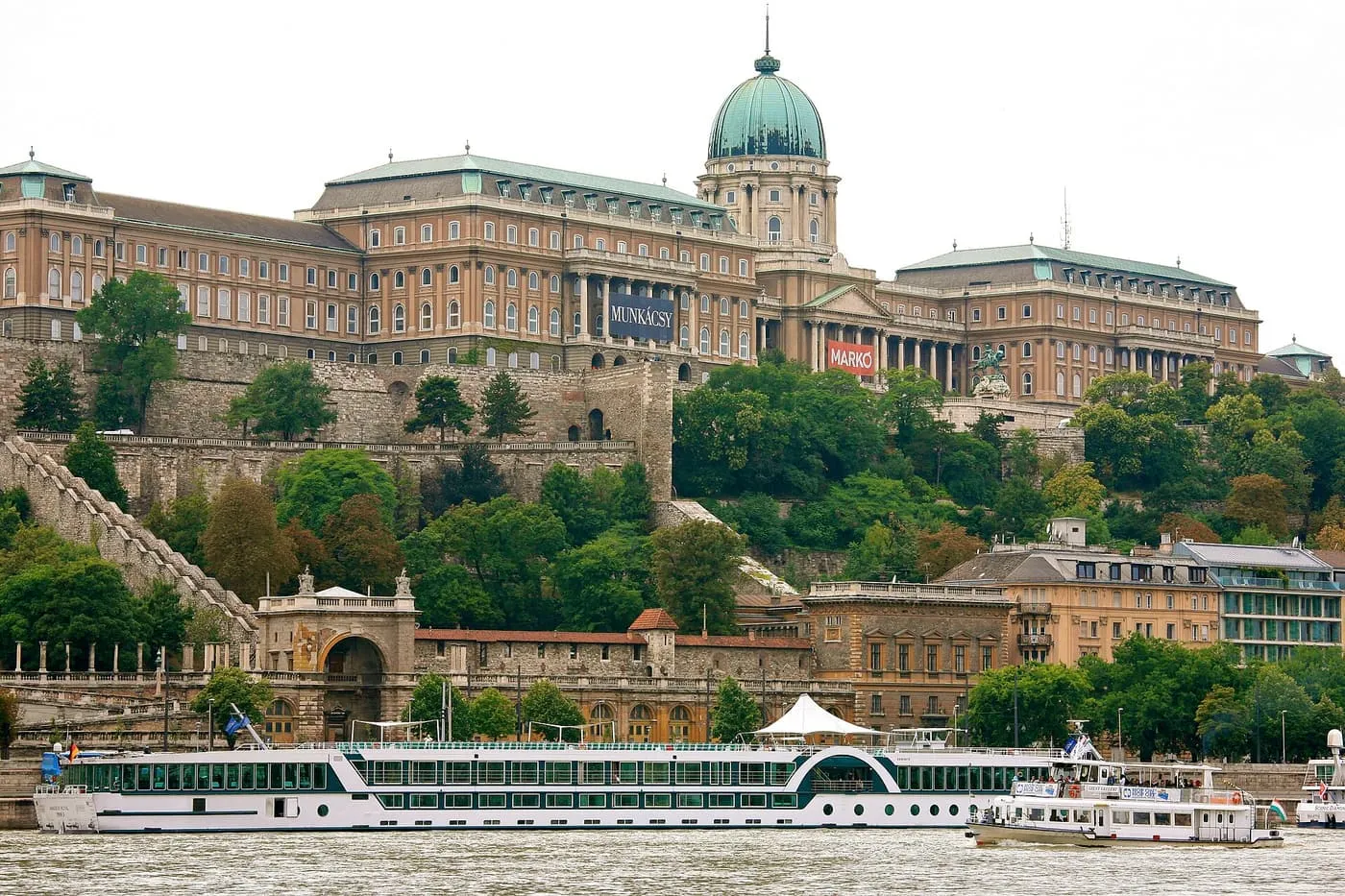 Buda Castle's long palace front with its green dome above the Danube and the Chain Bridge below
