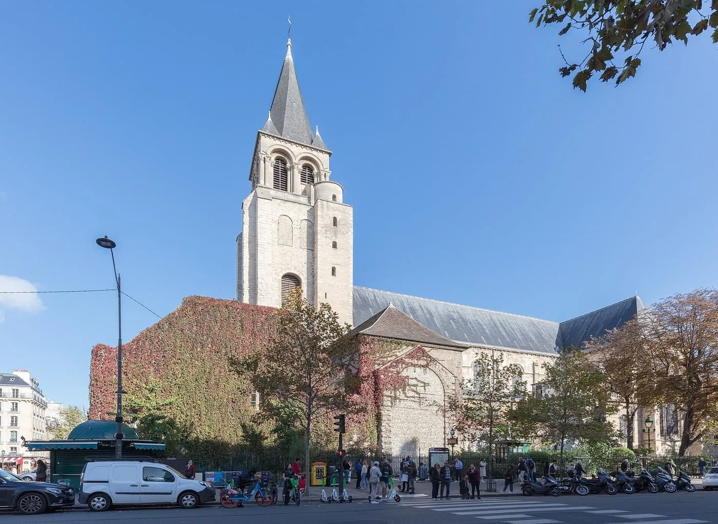 The Romanesque bell tower and ivy-covered walls of the church of Saint-Germain-des-Prés, seen from the boulevard