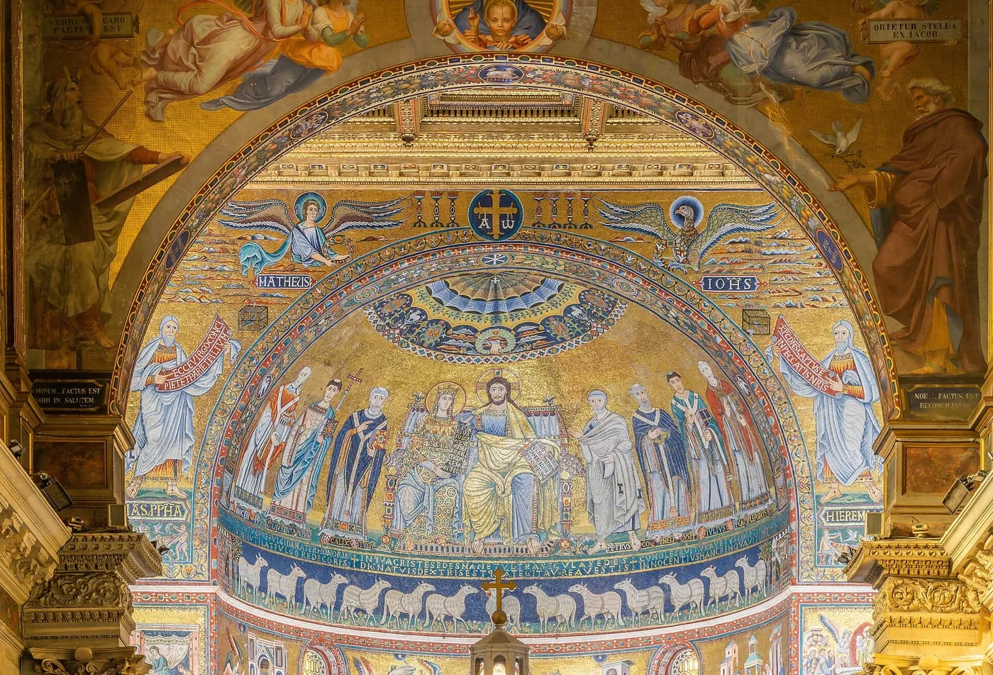 The apse arch of Santa Maria in Trastevere, a gold mosaic of Christ and the Virgin enthroned, with sheep along the lower band