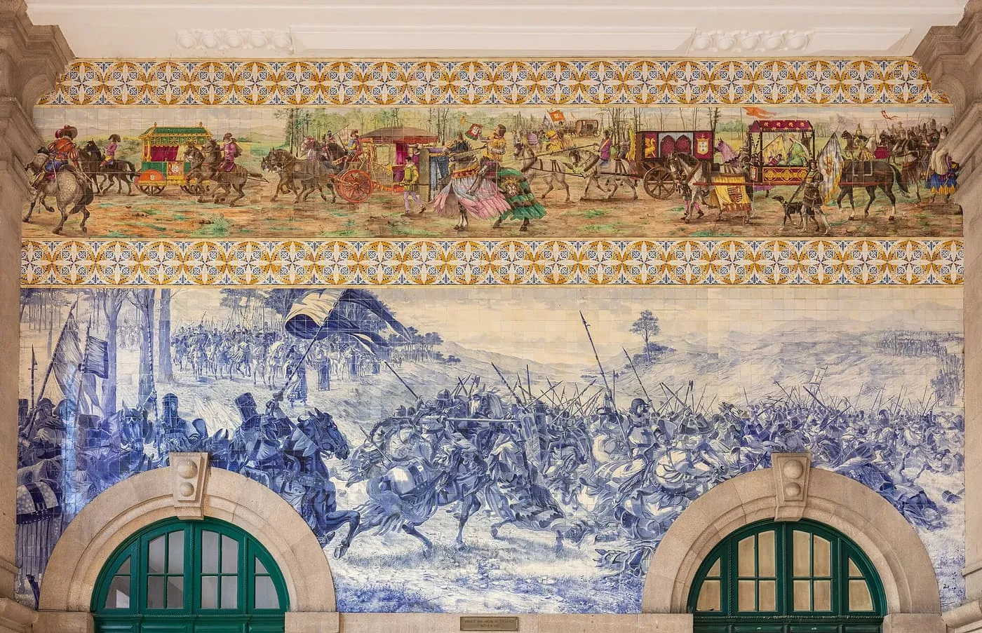 Blue-and-white and polychrome tile panels of a battle and a royal procession above two arched doors in São Bento station