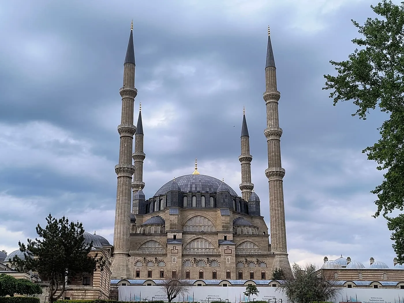 The Selimiye Mosque in Edirne, its central dome ringed by four tall fluted minarets under a stormy sky