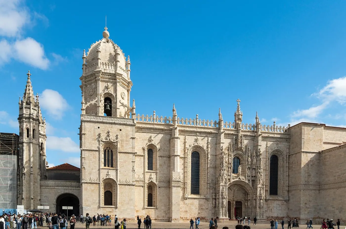 The pale limestone south front of the Jerónimos Monastery church, with its bell tower and carved south portal