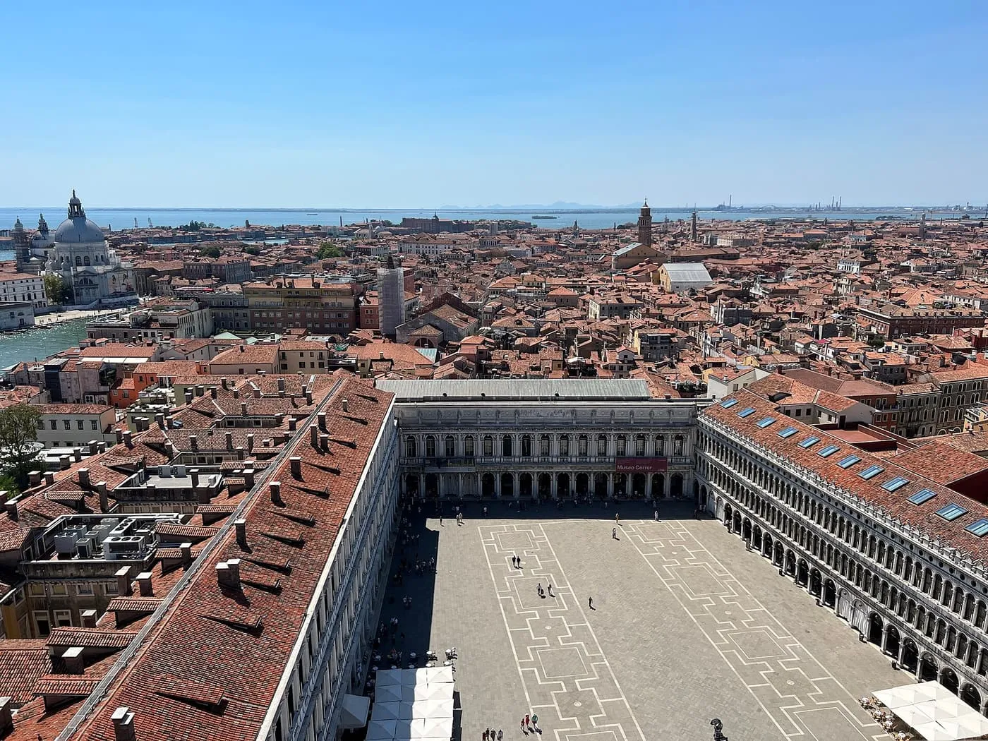 Piazza San Marco from above, with the arcades around the Square and the lagoon beyond