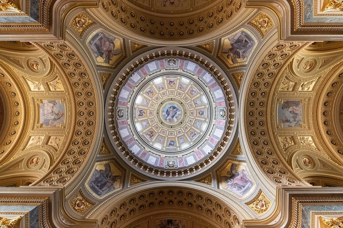 The painted and gilded dome of St Stephen's Basilica, seen from directly below
