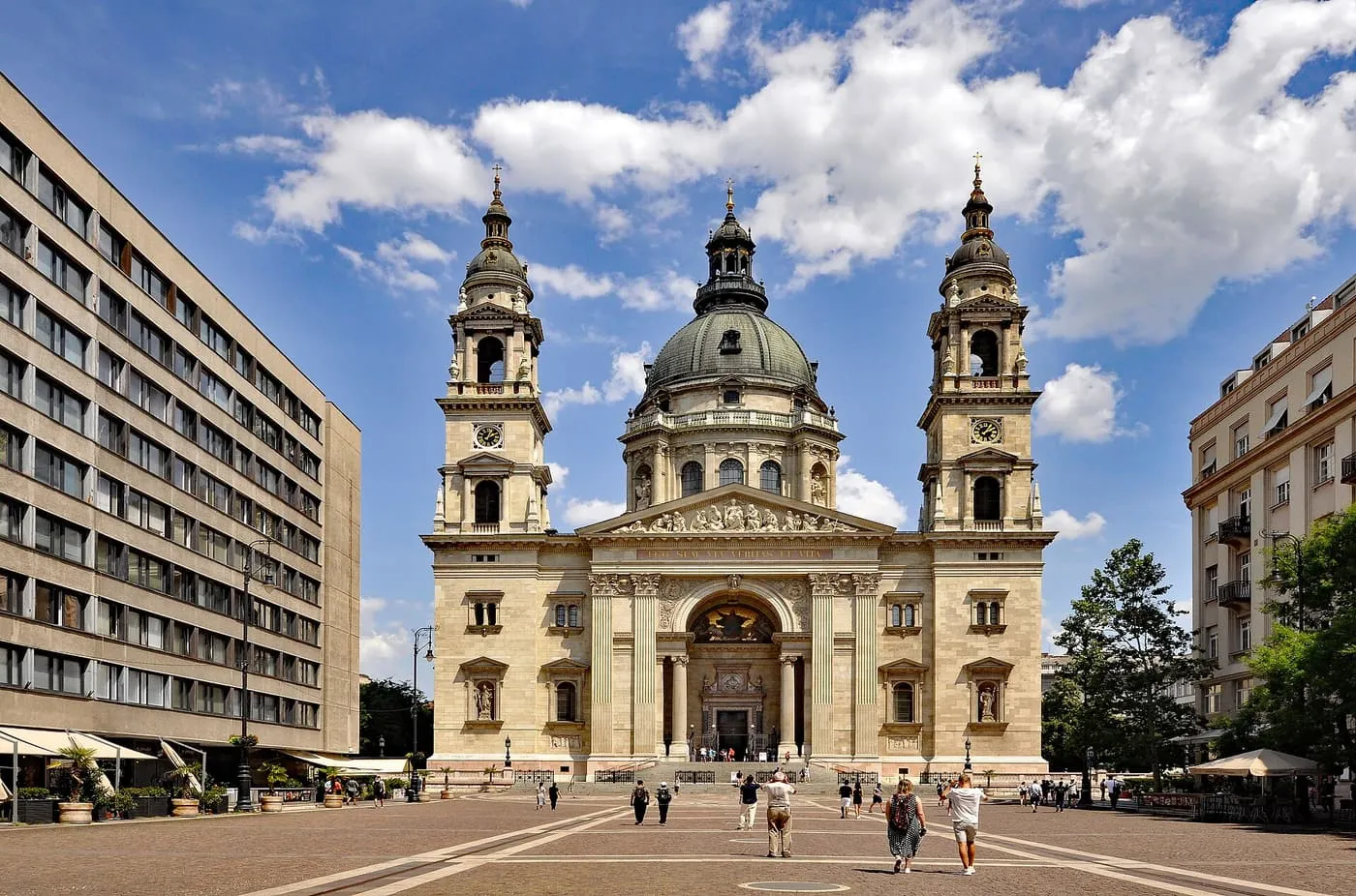 The front of St Stephen's Basilica, with its two towers and dome, across a paved square
