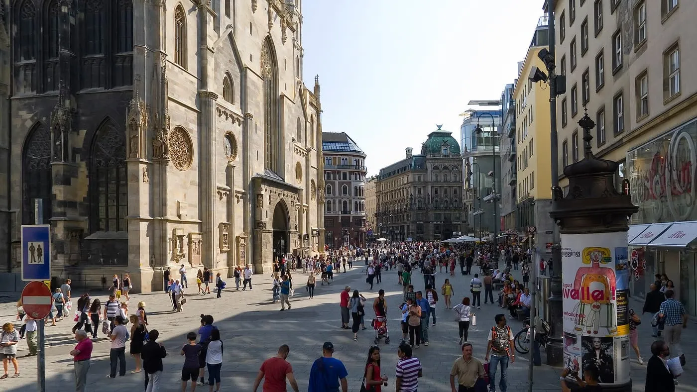 Stephansplatz with the flank of St Stephen's Cathedral on the left and people crossing the open square towards the streets beyond