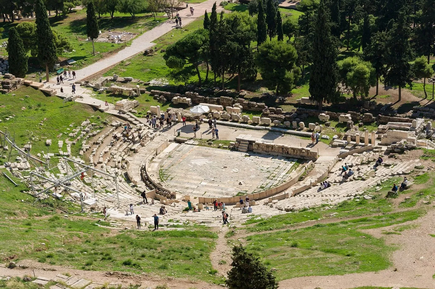 The semicircular rows of seats and marble floor of the Theatre of Dionysus, seen from above on the south slope of the Acropolis
