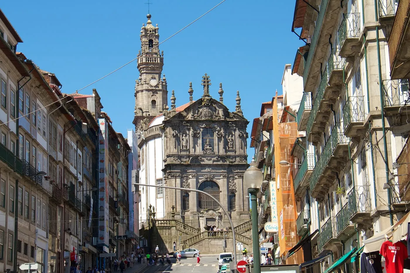 The Torre dos Clérigos and the Igreja dos Clérigos at the top of Rua dos Clérigos, with tall granite and tiled townhouses either side