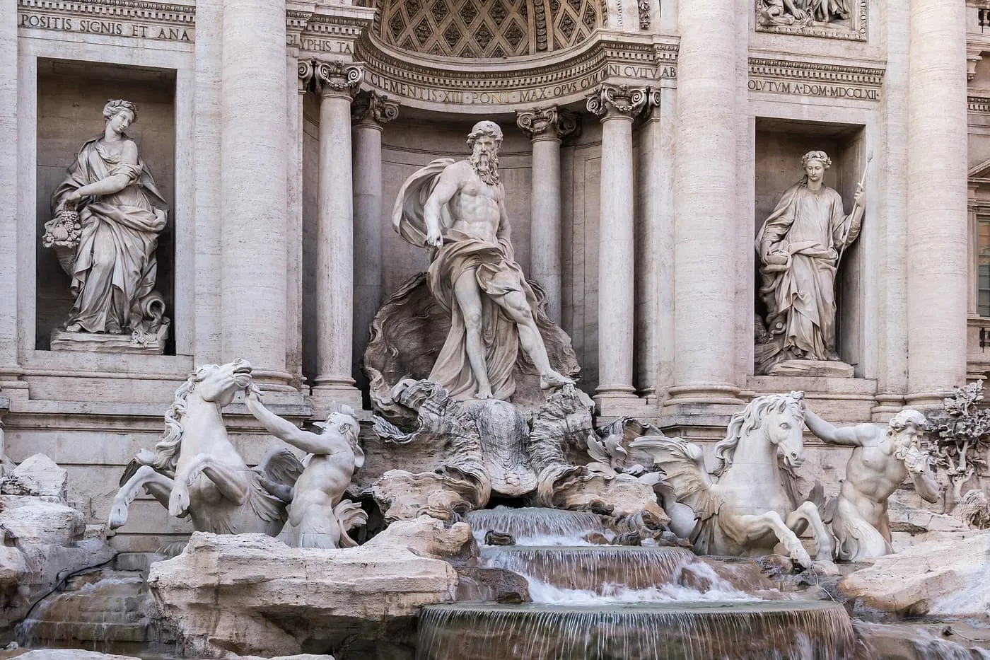 The Trevi Fountain's central niche with Oceanus on a shell chariot, flanked by two tritons leading winged sea horses