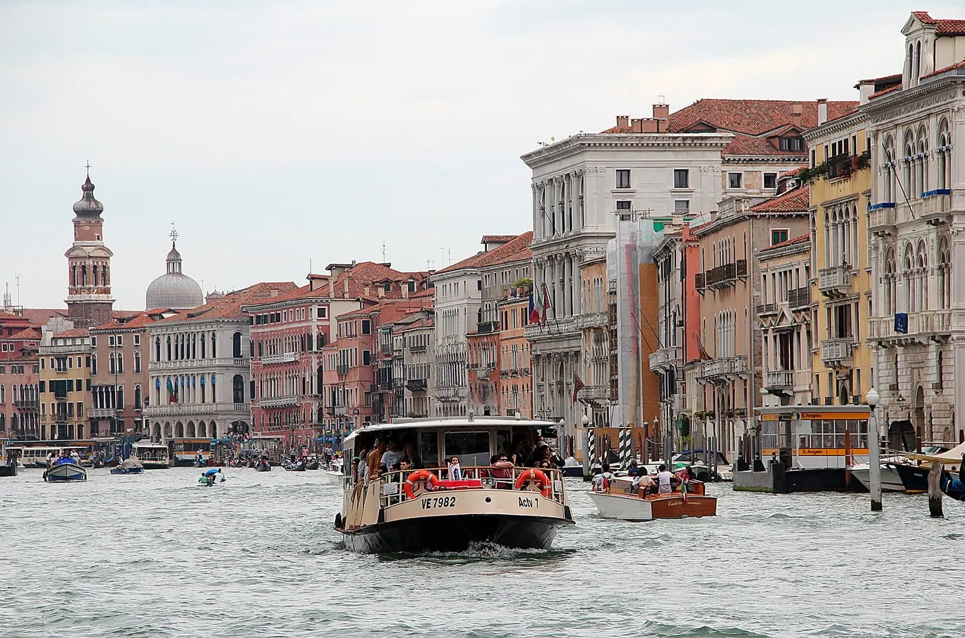 A vaporetto crossing the Grand Canal with palazzi along both banks