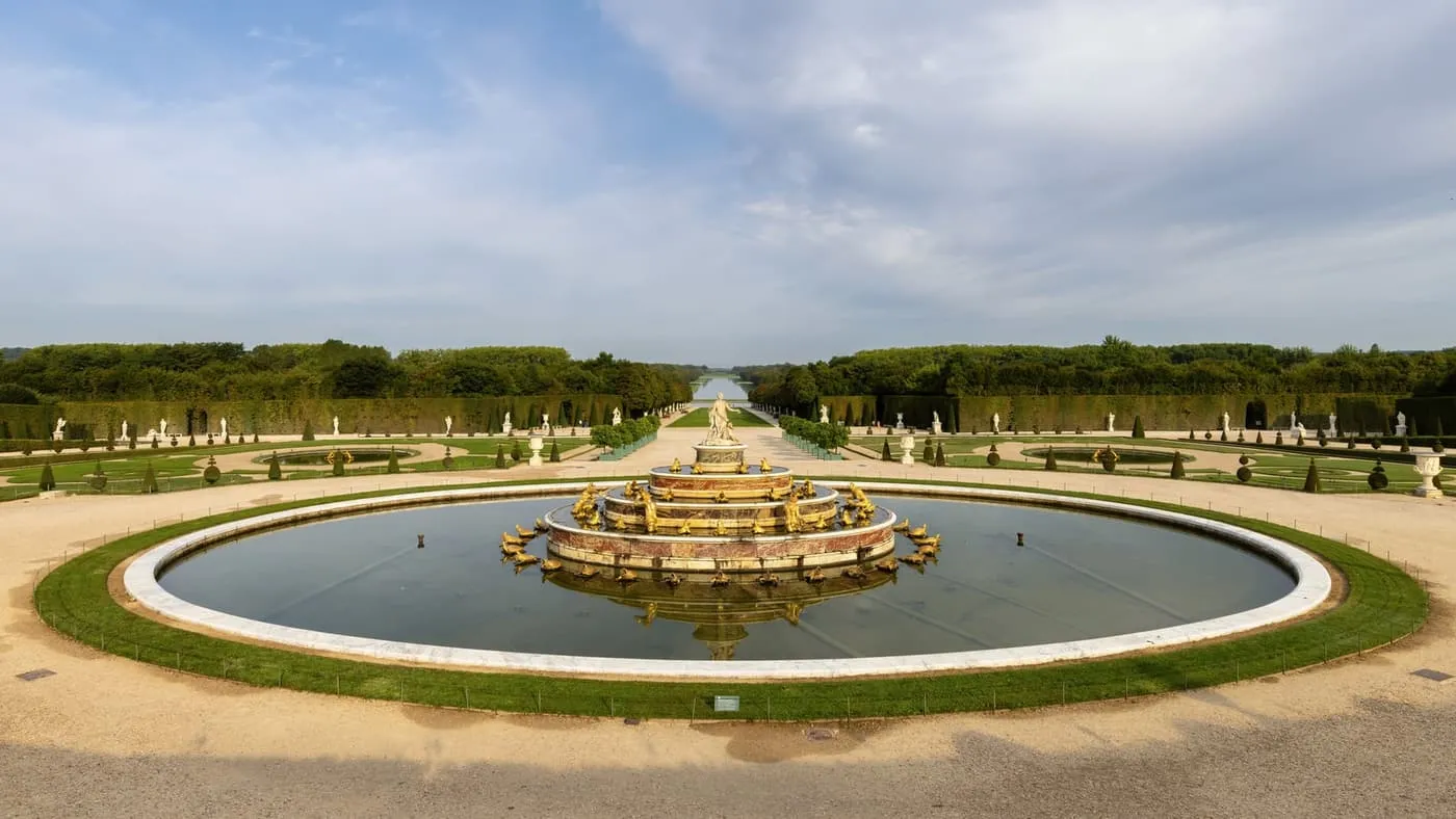 The Latona Fountain in the gardens of Versailles, with the Grand Canal in the distance