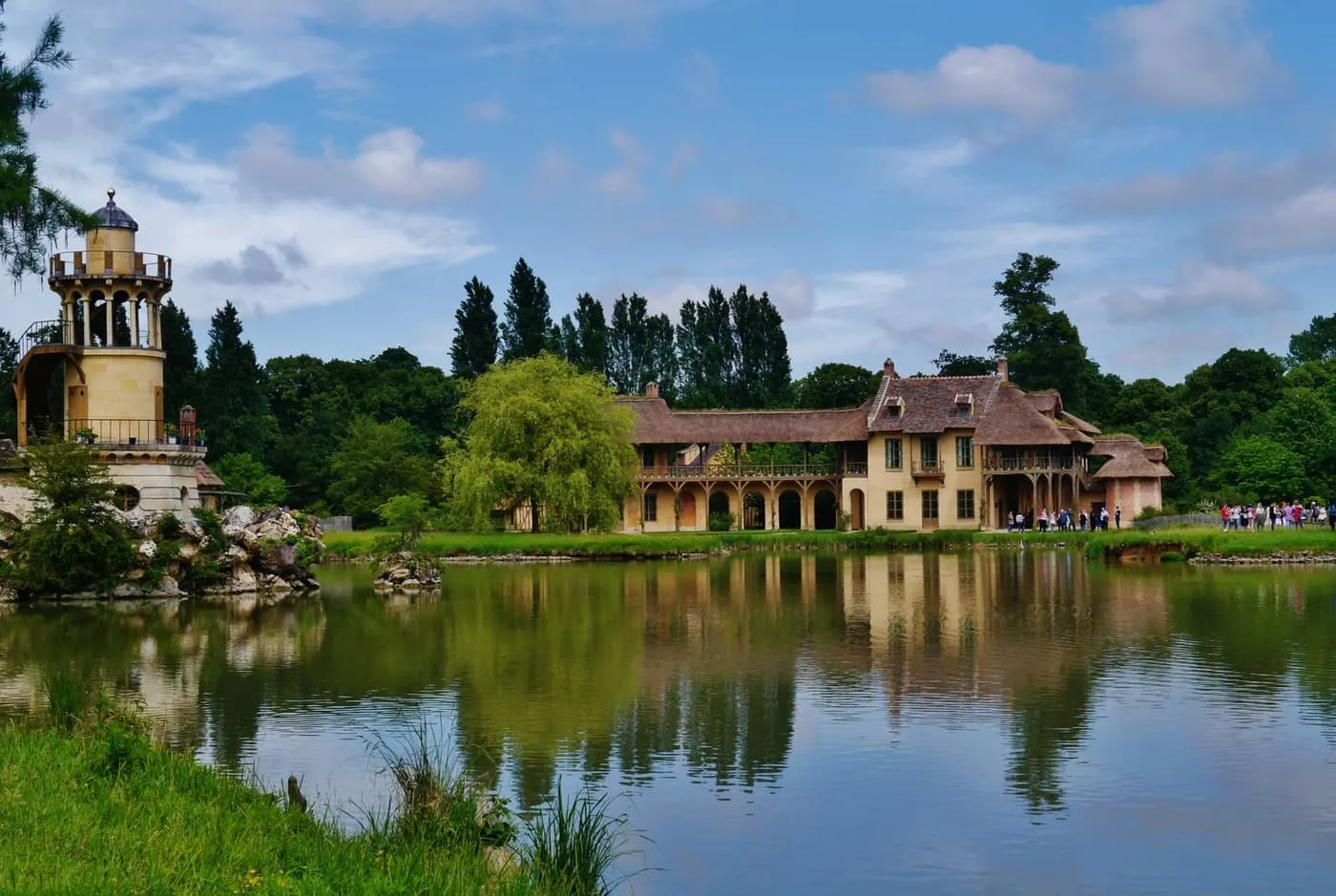 The Marlborough Tower and the Queen's House reflected in the lake at the Queen's Hamlet