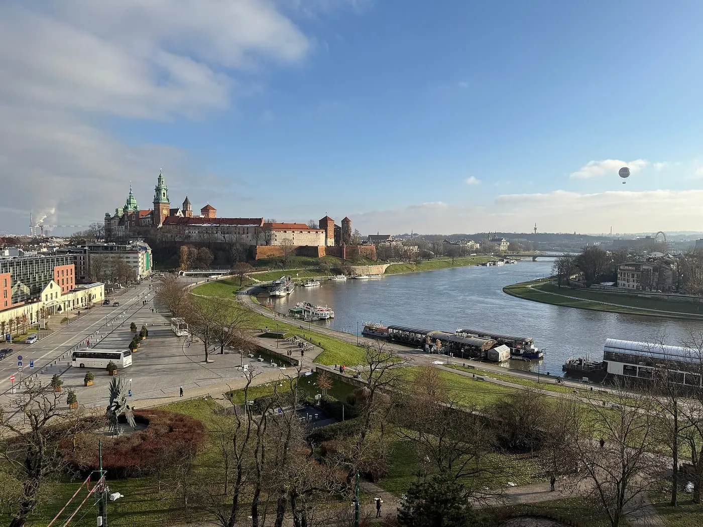Wawel Hill with the castle and cathedral on the skyline above the Vistula and its river bank